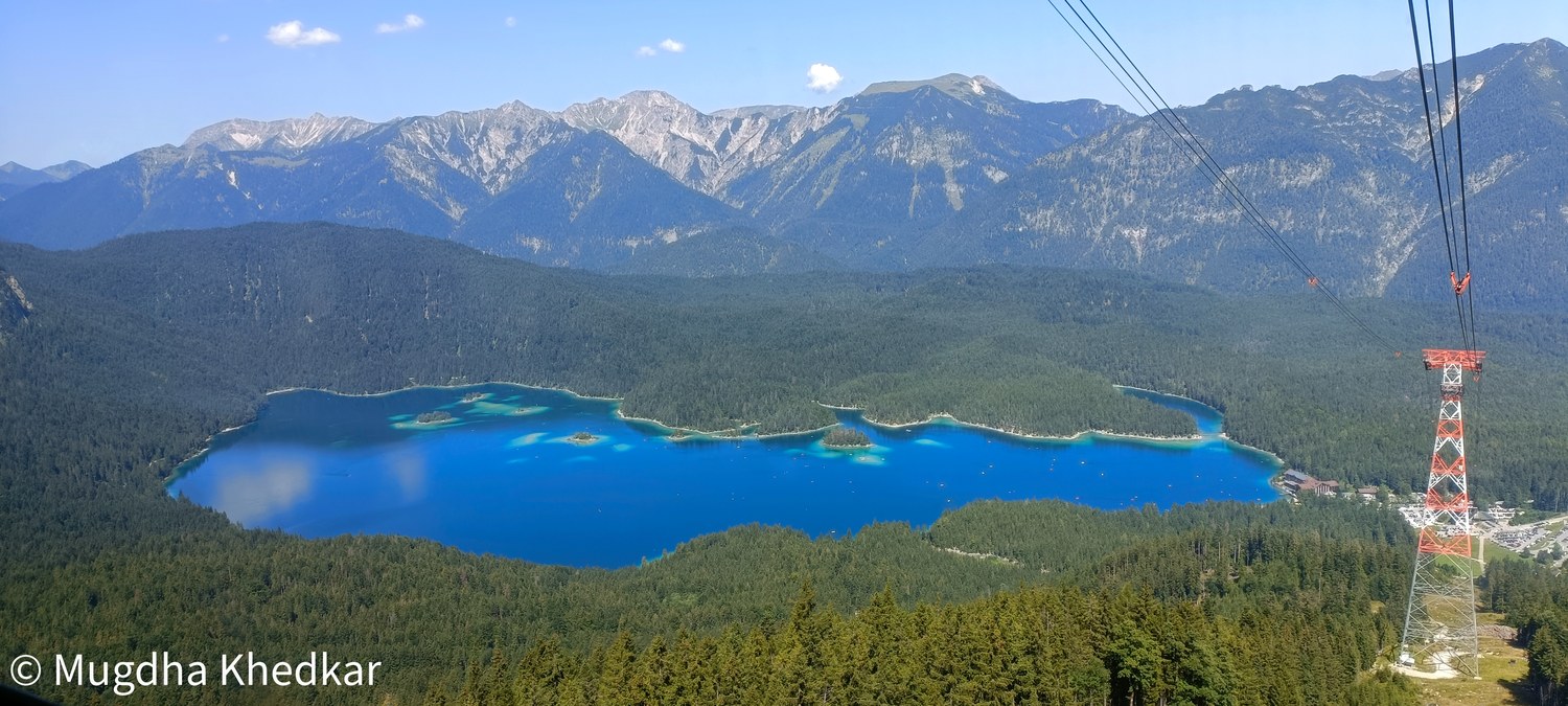 Eibsee lake from the Zugspitze cable car, surrounded by forest and mountains