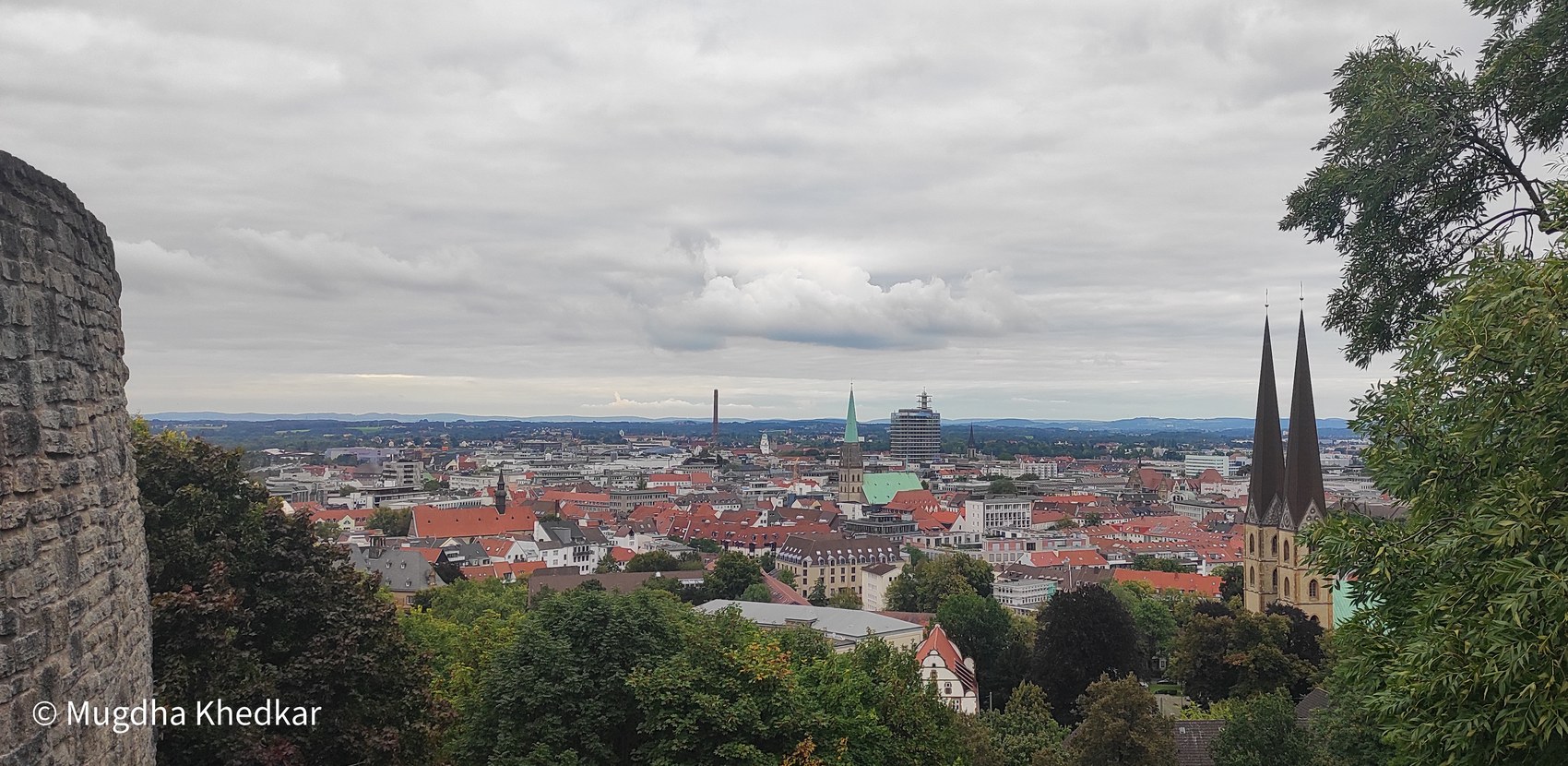 Red rooftops and church spires of Bielefeld seen from Sparrenburg Castle