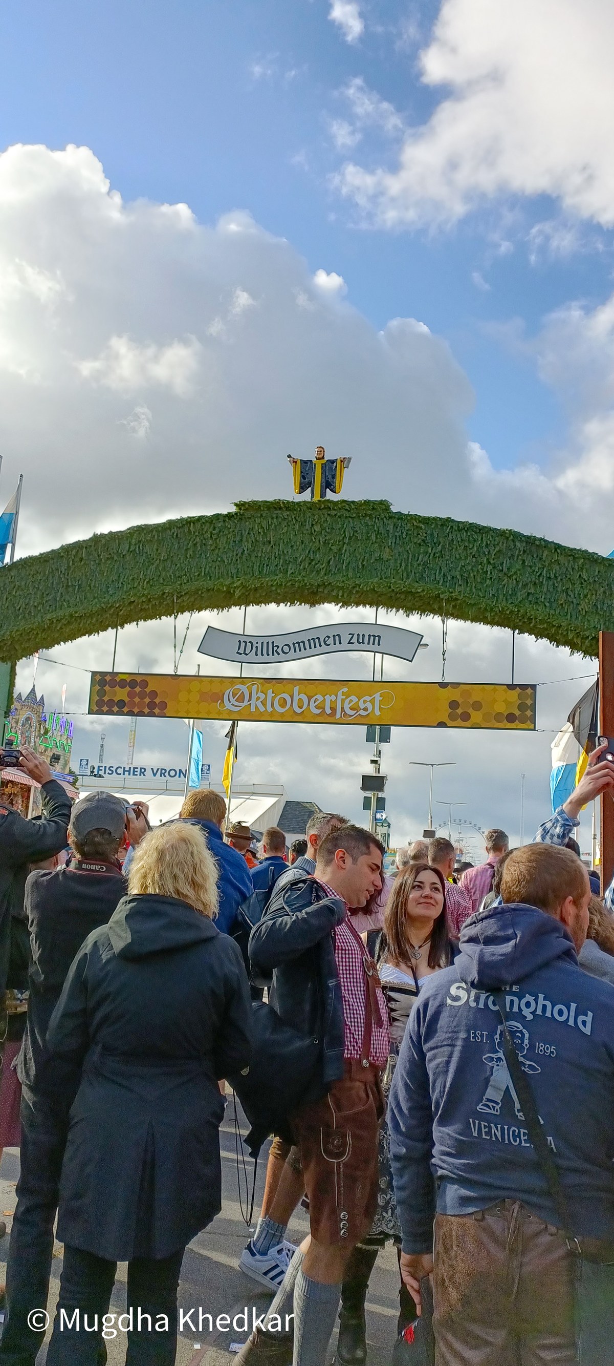 Crowds entering Oktoberfest in Munich under the welcome arch