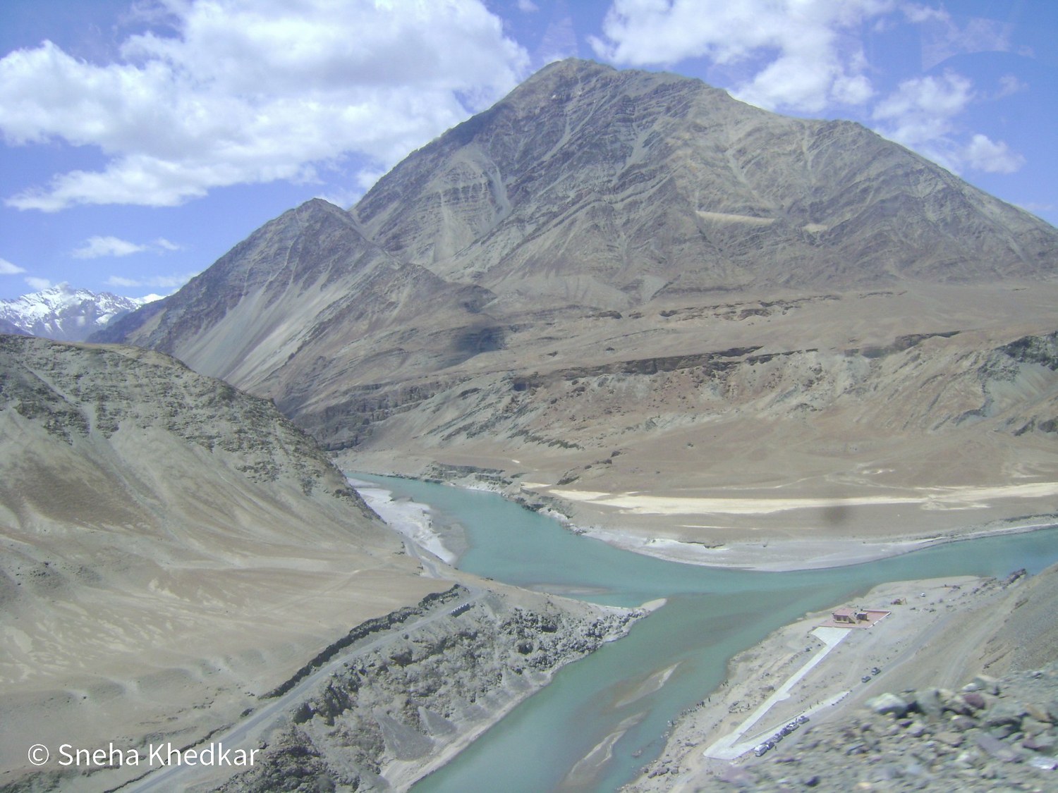 The confluence of the Indus and Zanskar rivers among barren mountains in Ladakh